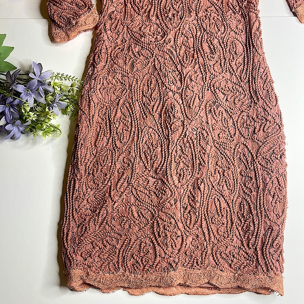 Pink mini dress with long sleeve and lace design